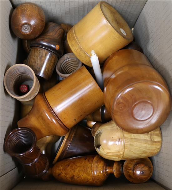 A group of Victorian and later treen including cased glass vessels, a cup holder and dice cups